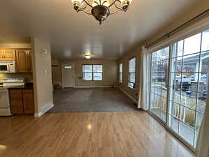 Interior space featuring a chandelier and light hardwood / wood-style flooring