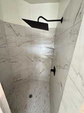 Bathroom with a tile shower