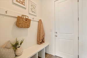 Mudroom with hardwood / wood-style flooring