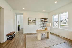 Office area with hardwood / wood-style floors