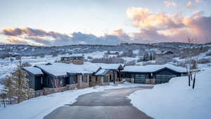 View of front facade with a mountain view and a garage