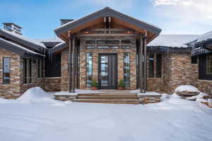 View of snow covered property entrance