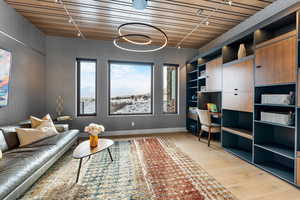 Interior space with light wood-type flooring and wood ceiling