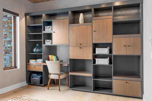 Home office featuring a wealth of natural light and light hardwood / wood-style floors