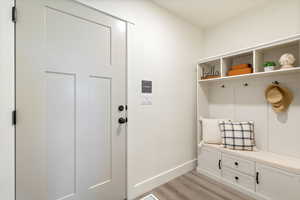 Mudroom featuring light hardwood / wood-style floors