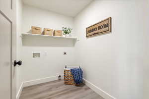 Laundry room with electric dryer hookup, hookup for a washing machine, and hardwood / wood-style floors