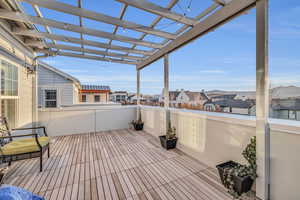 Deck featuring a pergola