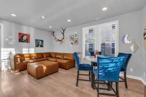 Living room with light wood-type flooring