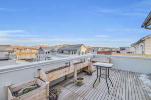 Deck featuring a water and mountain view