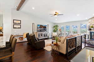 Living room with lofted ceiling with beams, ceiling fan, dark hardwood / wood-style flooring, and french doors