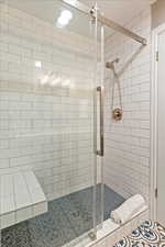 Bathroom with a shower with shower door