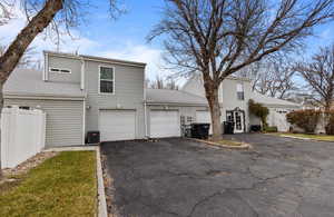 View of front of home featuring central air condition unit