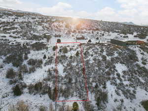 Snowy aerial view with a mountain view