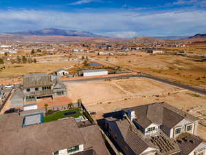 Birds eye view of property with a mountain view