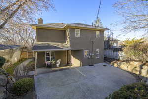 Rear view of property featuring a patio area