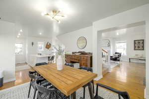 Dining space featuring an inviting chandelier and light hardwood / wood-style flooring