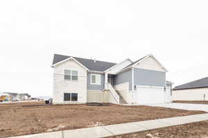 View of front of home with a garage