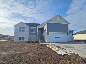 View of front of property featuring a garage