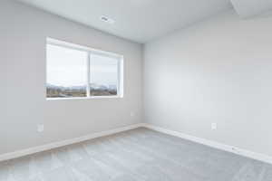 Unfurnished room with carpet