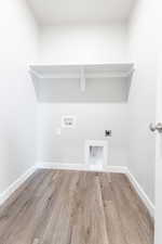 Washroom with washer hookup, hardwood / wood-style floors, and hookup for an electric dryer