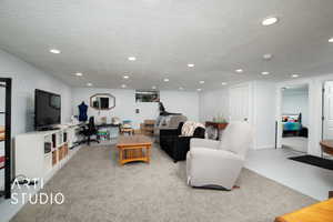 Living room featuring a textured ceiling