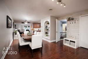 Dining area featuring dark hardwood / wood-style flooring and ceiling fan