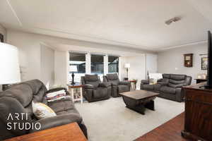 Living room with dark hardwood / wood-style flooring