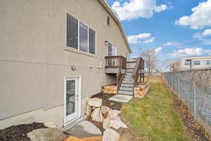 Exterior space featuring a deck and a yard