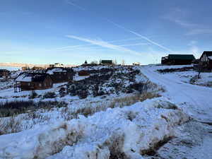 View of yard layered in snow