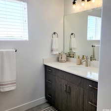 Bathroom with tile patterned flooring and vanity