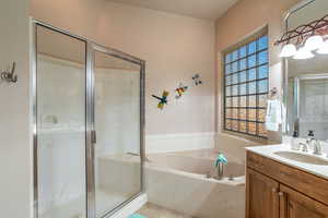 Bathroom with plus walk in shower and vanity