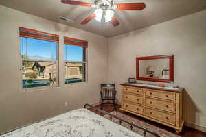 Bedroom featuring a mountain view and ceiling fan