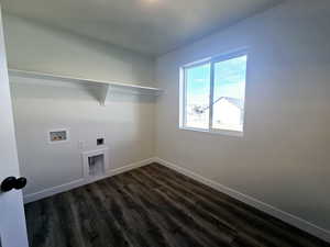 Washroom with hookup for a washing machine, dark hardwood / wood-style flooring, and electric dryer hookup