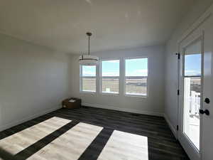 Unfurnished room with dark hardwood / wood-style floors