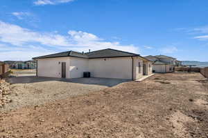 Back of property with central air condition unit