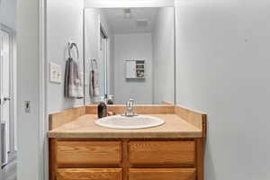 Bathroom featuring vanity and hardwood / wood-style flooring