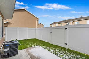 View of yard with a patio and central AC