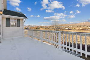 View of patio of primary suite featuring a mountain view