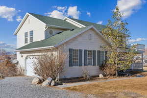 View of property featuring a garage