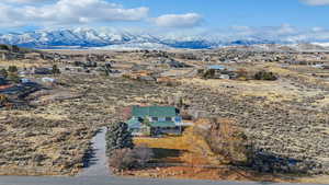 Birds eye view of property with a mountain view