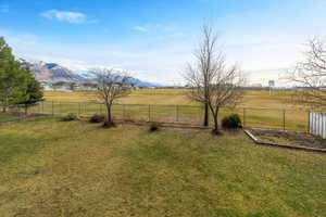 View of yard featuring a mountain view and a rural view