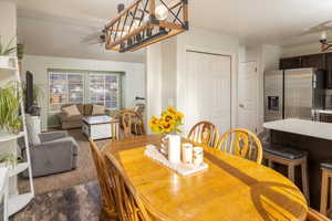 Dining area featuring dark hardwood / wood-style floors and ceiling fan