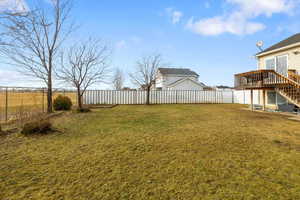 View of yard featuring a wooden deck