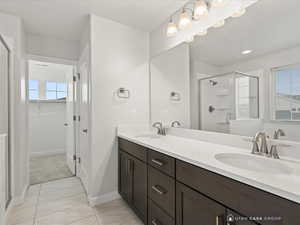 Bathroom with vanity and an enclosed shower