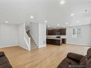 Living room with light wood-type flooring