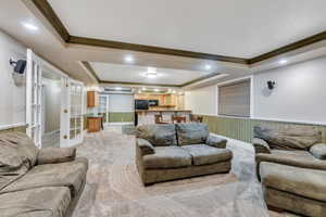 Large basement family room connects to kitchen and features french doors to the hallway