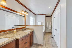 Primary bathroom has double sinks and granite countertops