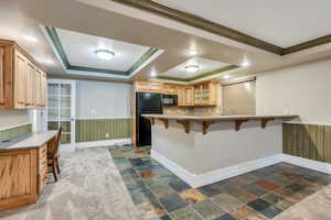 Basement kitchen has extra barstool seating