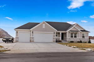 Craftsman-style home featuring a mountain view and a garage