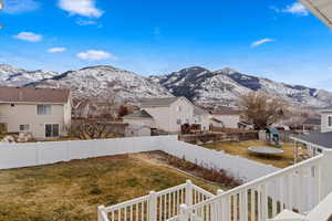 View of yard with a mountain view and a trampoline